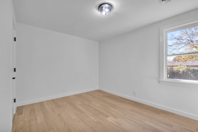 unfurnished room featuring light hardwood / wood-style floors