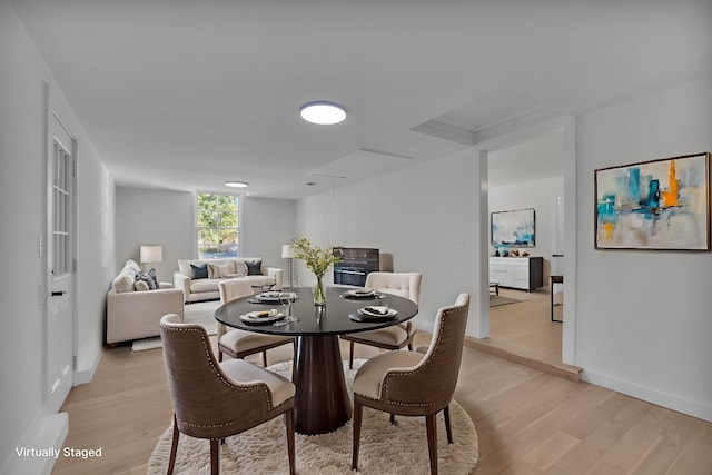 dining space featuring light wood-type flooring