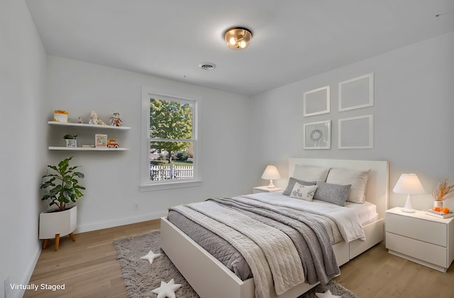 bedroom with light hardwood / wood-style floors