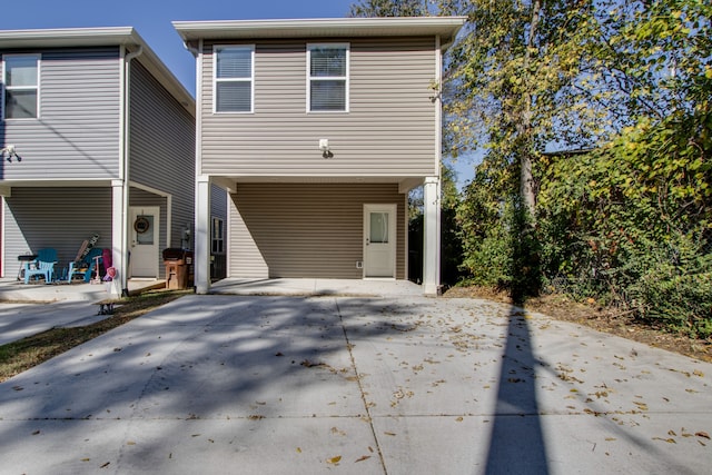 rear view of property featuring a carport