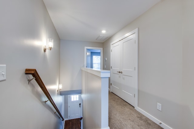 staircase with carpet floors