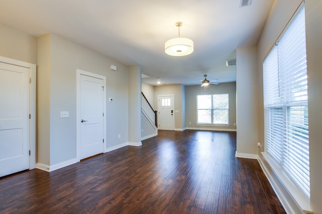 spare room featuring ceiling fan and dark hardwood / wood-style flooring