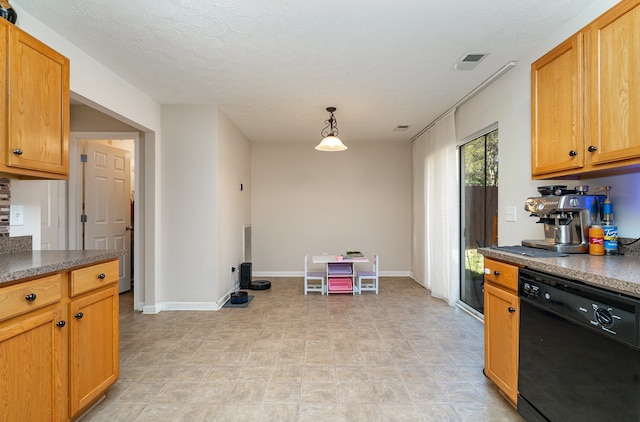 kitchen featuring black dishwasher, hanging light fixtures, and a textured ceiling