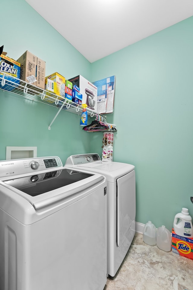 washroom featuring washer and clothes dryer