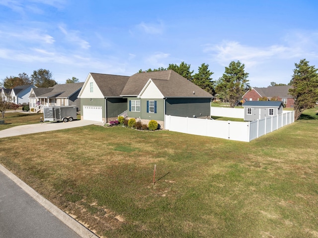 view of front of home featuring a front yard and a garage