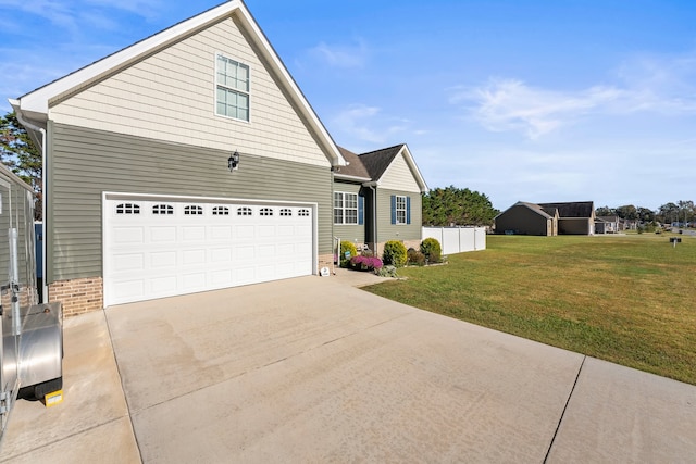 view of front facade featuring a front lawn and a garage