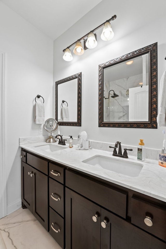 bathroom with vanity and a shower