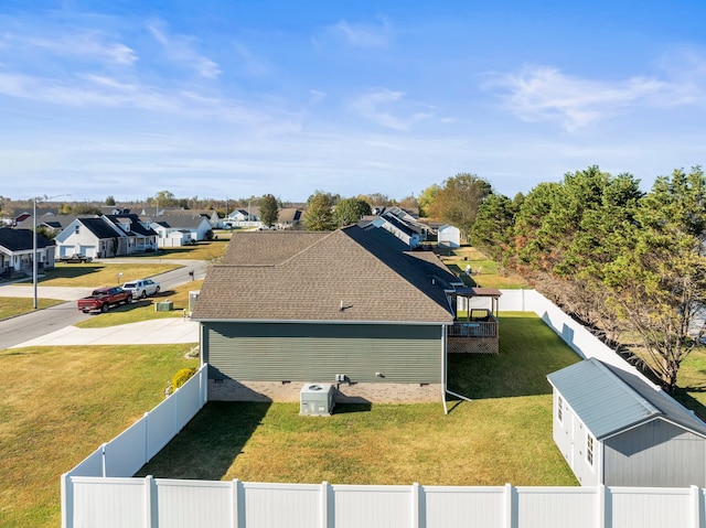 view of side of property with a lawn