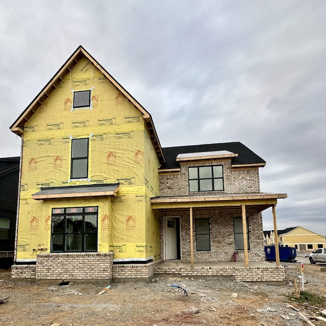 property under construction with covered porch