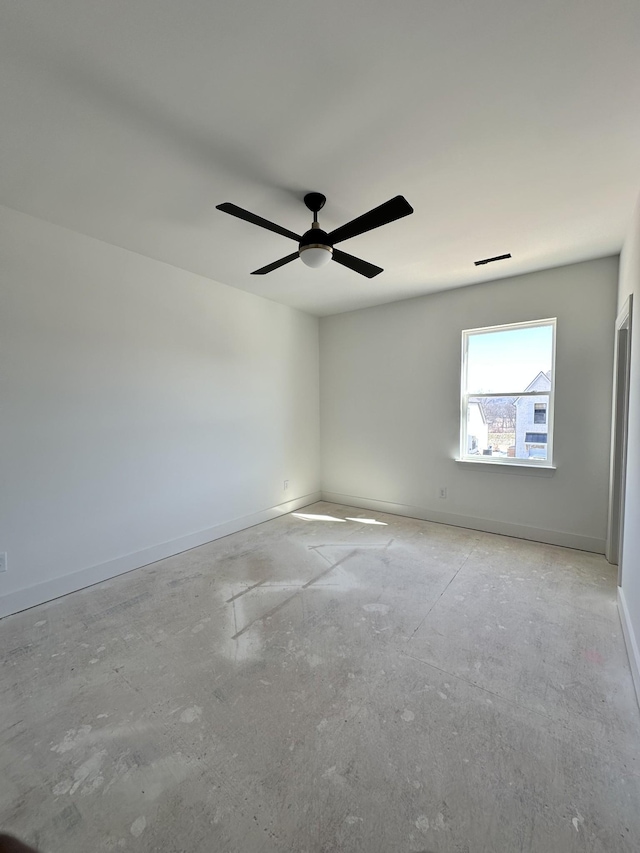 empty room featuring visible vents, baseboards, and a ceiling fan