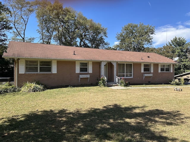 ranch-style house with a front lawn