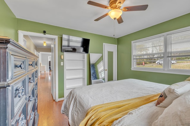 bedroom featuring light hardwood / wood-style floors and ceiling fan