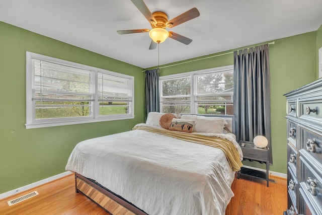 bedroom featuring light hardwood / wood-style flooring and ceiling fan