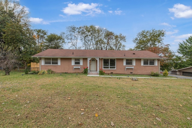 ranch-style house featuring a front lawn