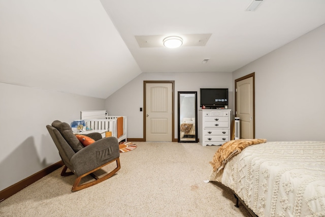 carpeted bedroom featuring vaulted ceiling