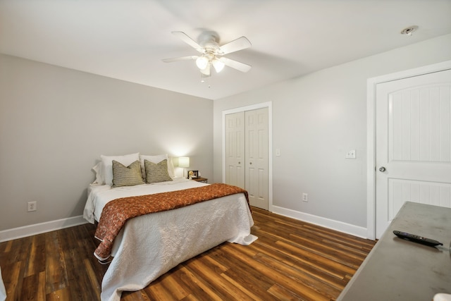 bedroom featuring dark hardwood / wood-style floors, a closet, and ceiling fan