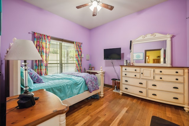 bedroom featuring light wood-type flooring and ceiling fan