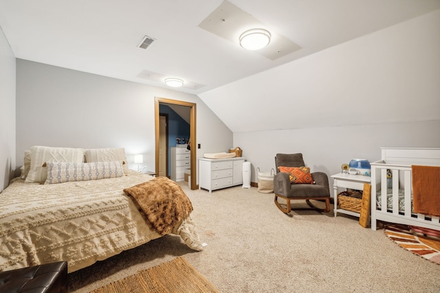 bedroom featuring carpet and vaulted ceiling