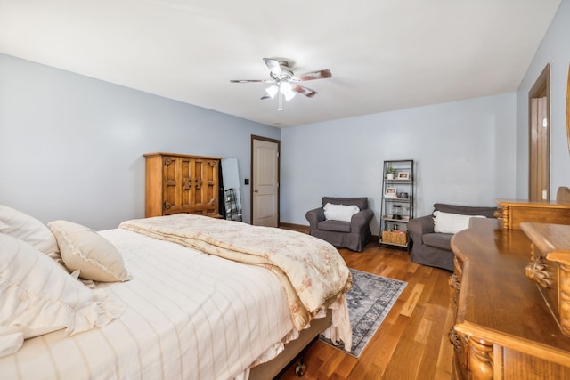 bedroom with light hardwood / wood-style floors and ceiling fan