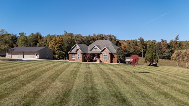 view of front facade featuring a front lawn and a garage