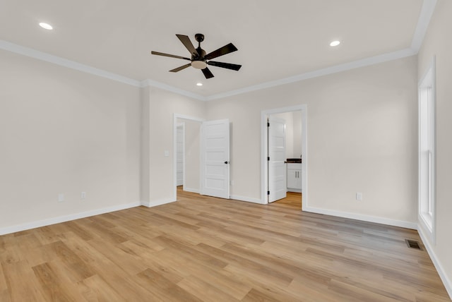 unfurnished bedroom featuring ceiling fan, crown molding, ensuite bathroom, and light hardwood / wood-style floors