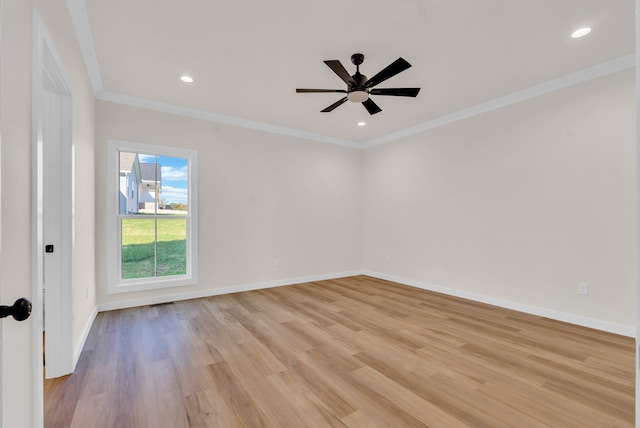 spare room featuring ornamental molding, light hardwood / wood-style flooring, and ceiling fan