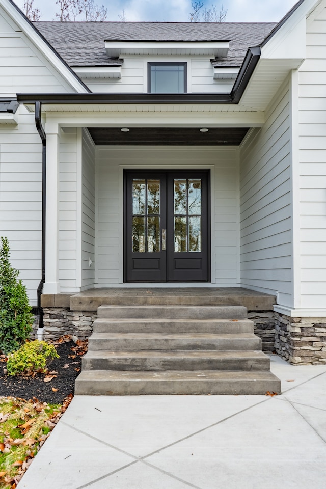 property entrance featuring french doors