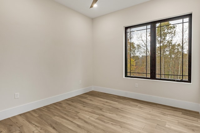 unfurnished room with light hardwood / wood-style floors