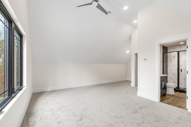 bonus room with ceiling fan, light colored carpet, and lofted ceiling