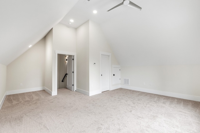 bonus room featuring light carpet, vaulted ceiling, and ceiling fan