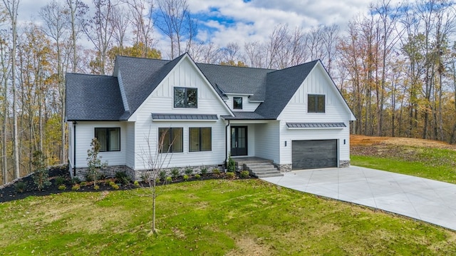 modern farmhouse with a garage and a front lawn