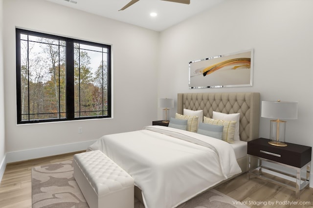 bedroom featuring ceiling fan and light wood-type flooring