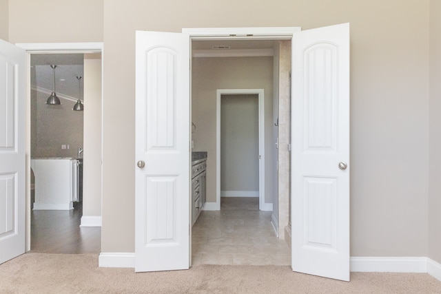 interior space featuring light colored carpet