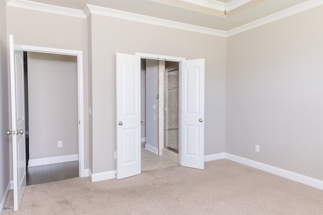 unfurnished bedroom featuring light carpet and ornamental molding