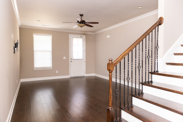 entryway with crown molding, ceiling fan, and dark hardwood / wood-style flooring