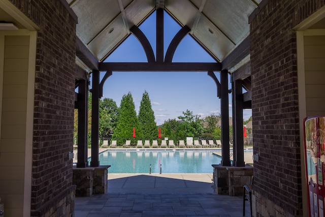 view of swimming pool featuring a patio area