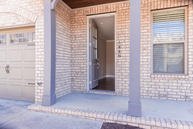 view of exterior entry featuring a garage