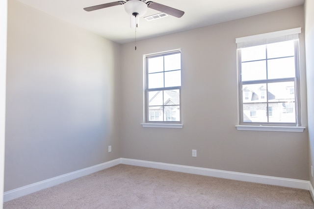 empty room with light carpet and ceiling fan