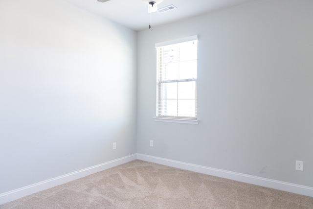 unfurnished room with ceiling fan and carpet floors