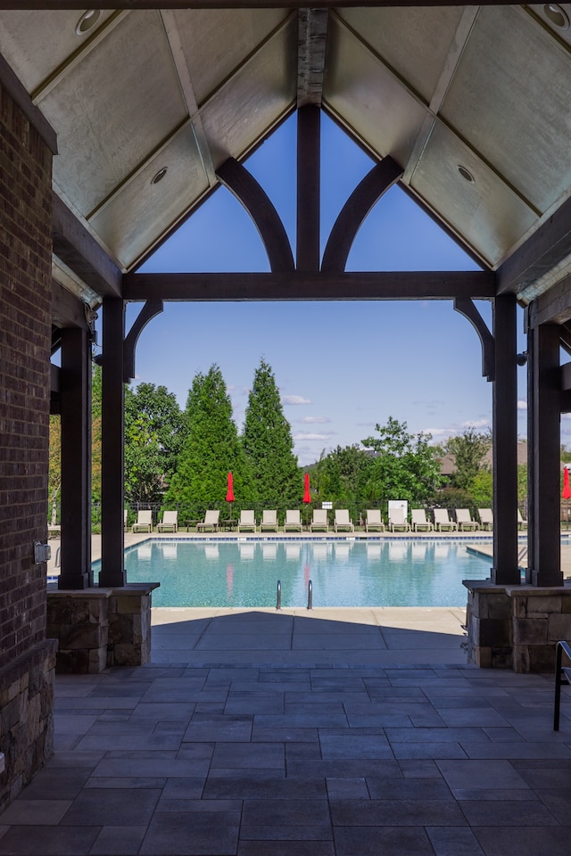 view of swimming pool featuring a patio area