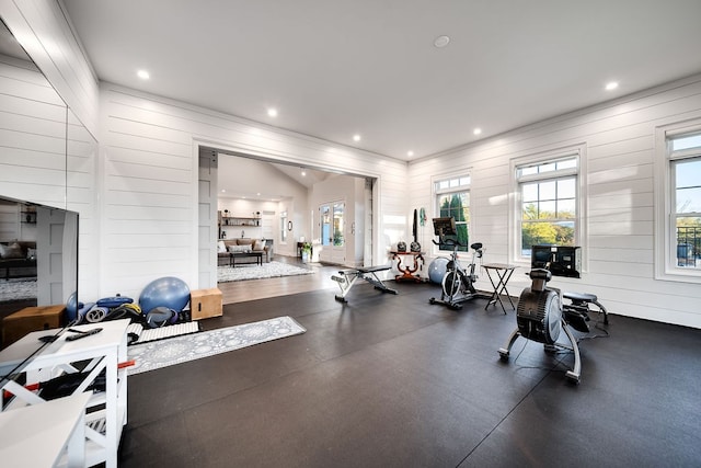 workout area featuring wood walls