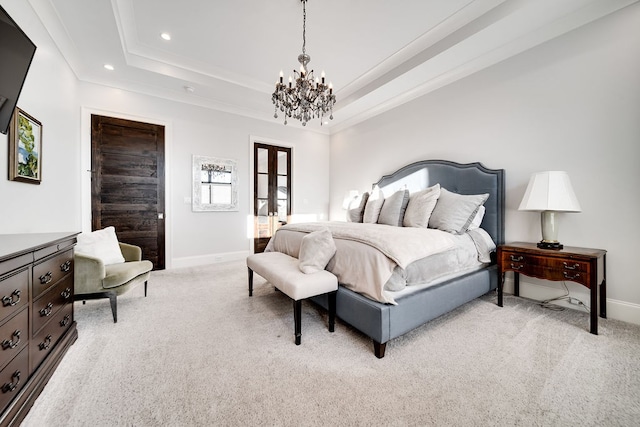 bedroom with french doors, a raised ceiling, light carpet, a notable chandelier, and ornamental molding