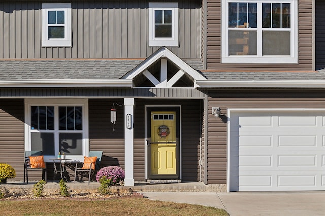 property entrance with a porch and a garage