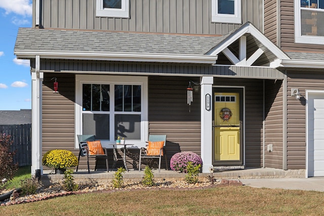 entrance to property featuring covered porch