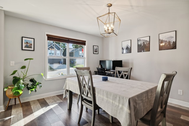 dining area featuring a notable chandelier and dark hardwood / wood-style floors