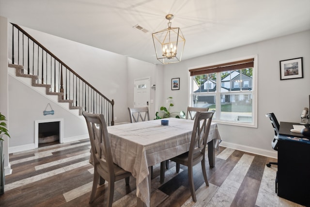 dining room featuring a chandelier and wood-type flooring