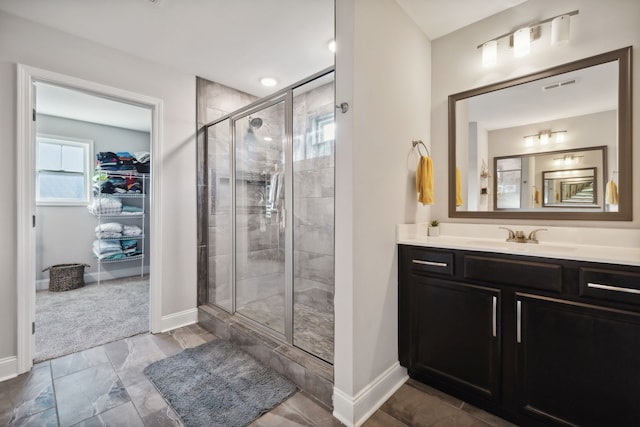 bathroom with vanity and an enclosed shower