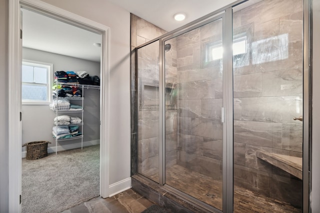 bathroom with a shower with shower door