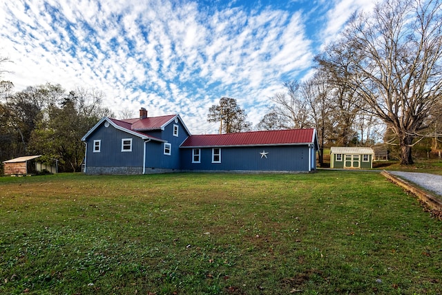 exterior space featuring an outdoor structure and a yard