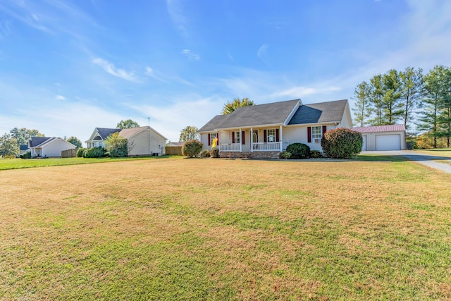 single story home with covered porch, a front yard, and a garage